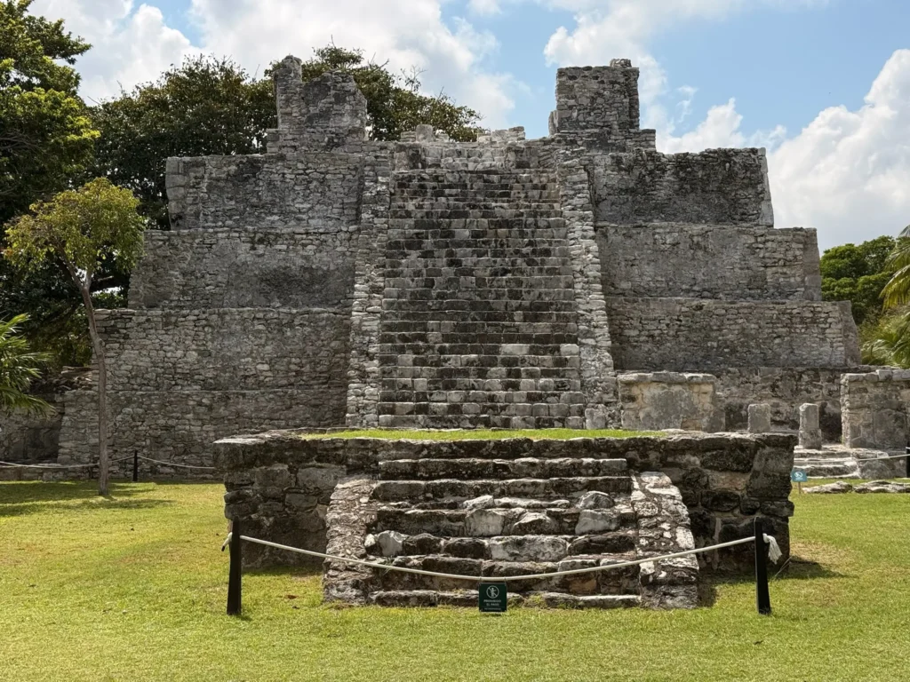 El Meco archeological zone in Cancun featuring the El Castillo pyramid and ancient Maya stone steps.